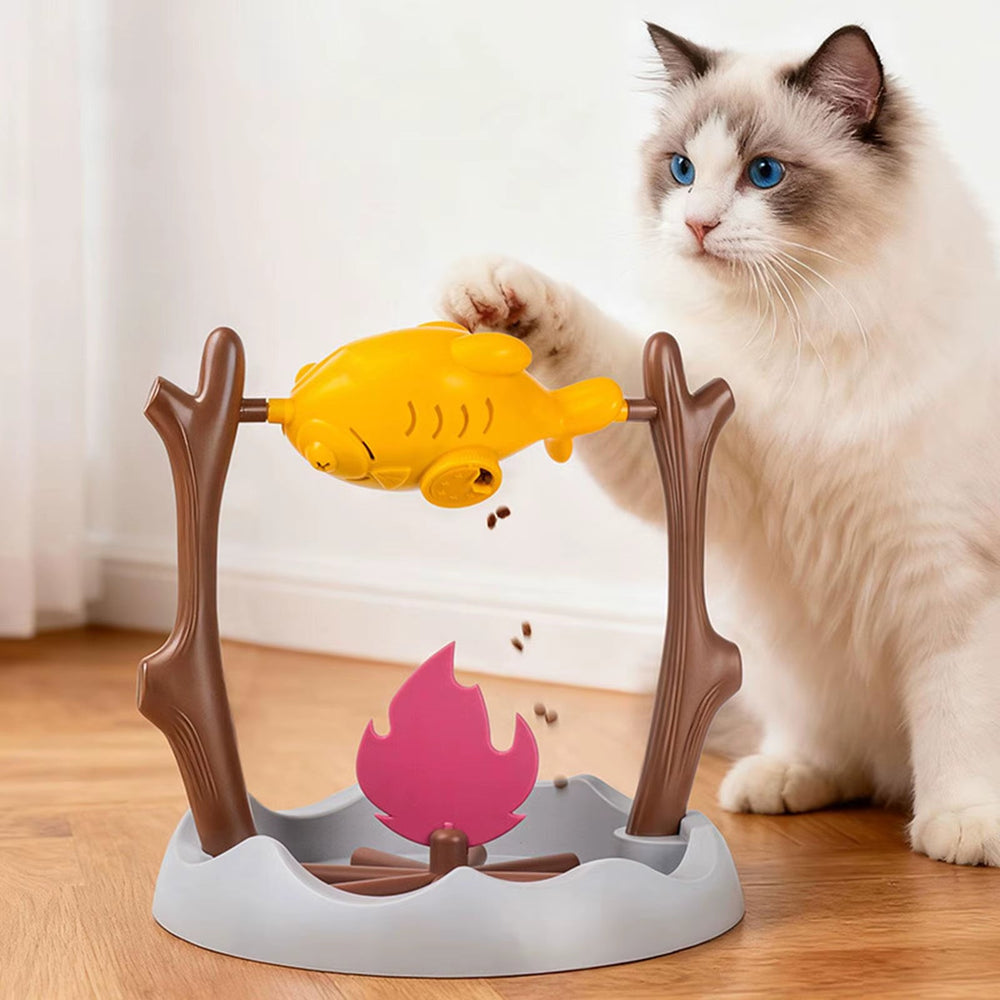 Ragdoll cat playing with the chicken leg treat spinner